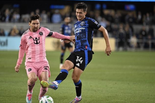 San Jose Earthquakes midfielder Beau Leroux (right) vs. Inter Miami CF's Lionel Messi