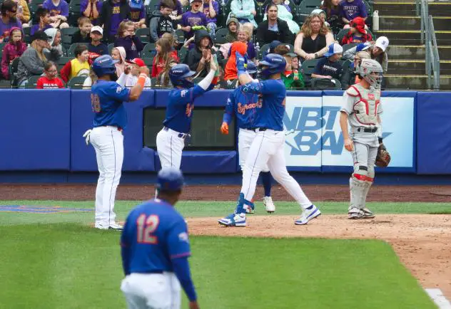 Joey Meneses of the Syracuse Mets crosses home plate