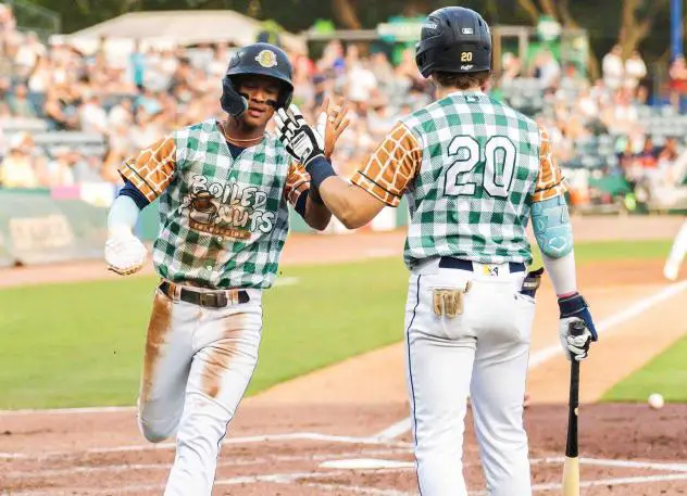 Narciso Polanco of the Charleston RiverDogs is greeted at the plate