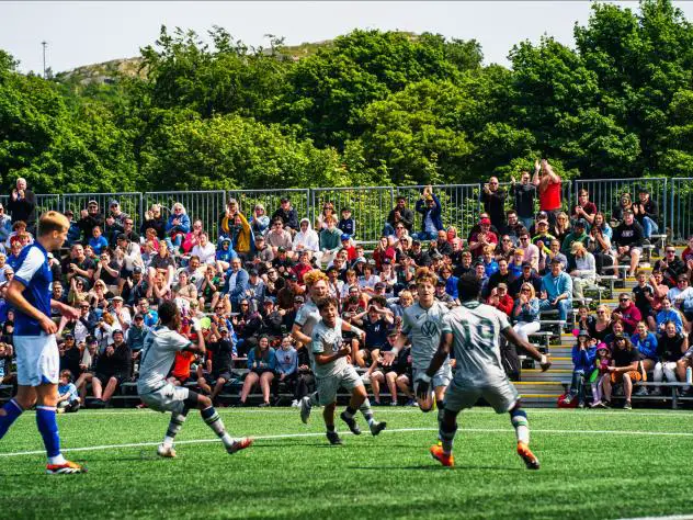 Ben Marsh (centre) celebrates scoring for Wanderers U21