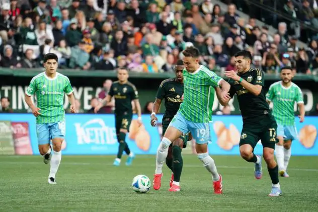 Seattle Sounders FC's Danny Musovski and Portland Timbers' Cristhian Paredes in action