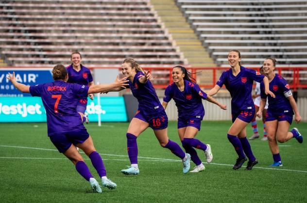 Calgary Wild FC react after Jenaya Robertson's goal