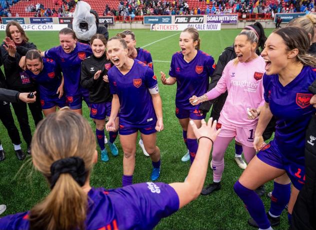 Calgary Wild FC celebrates their win over Montreal Roses FC