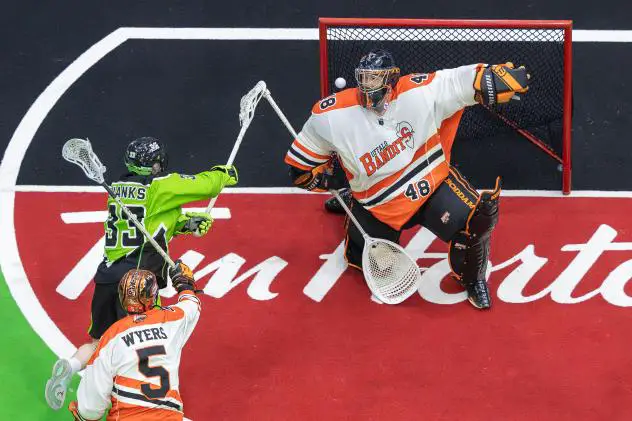 Saskatchewan Rush forward Austin Shanks scores against the Buffalo Bandits