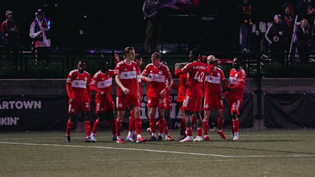 Chicago Fire FC breaks their huddle after a score against the New England Revolution