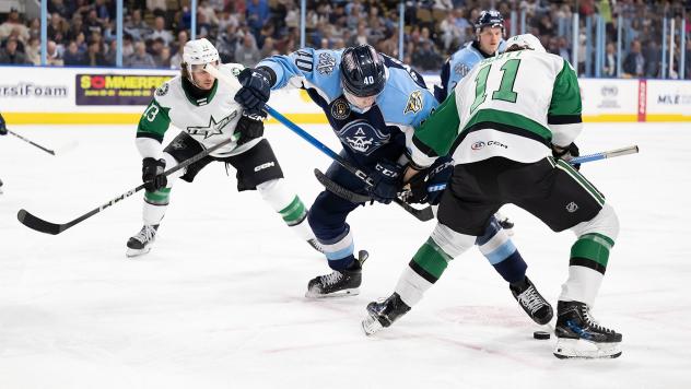 Texas Stars' Matthew Seminoff and Harrison Scott battle Milwaukee Admirals' Fedor Svechkov