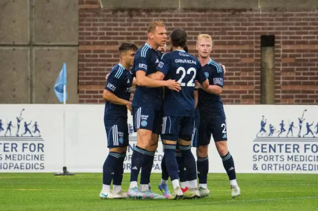 Chattanooga FC gathers after Peter Plougmand's goal