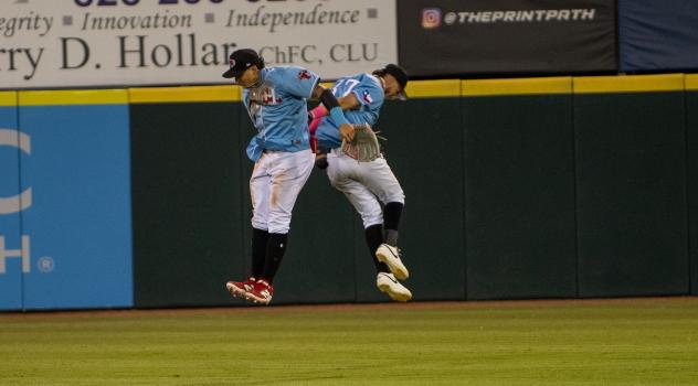 Hickory Crawdads celebrate in the outfield