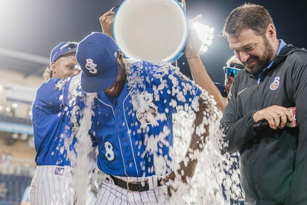 Biloxi Shuckers douse Zavier Warren after the game