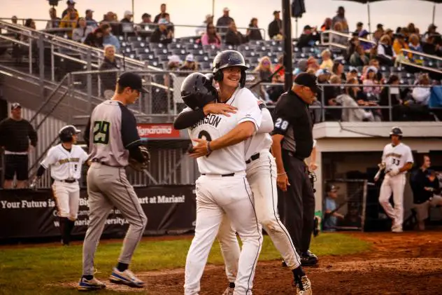 Fond du Lac Dock Spider' Kelsen Johnson (left) hugs Jaron Cotton