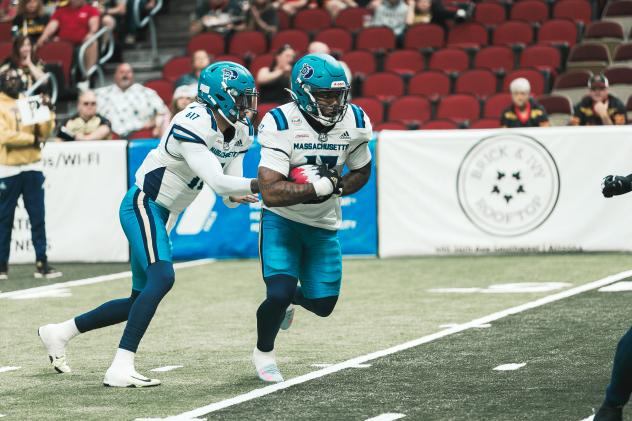 Massachusetts Pirates running back Tiyon Evans takes the handoff
