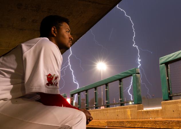 Fargo-Moorhead RedHawks watch the lightning from the dugout