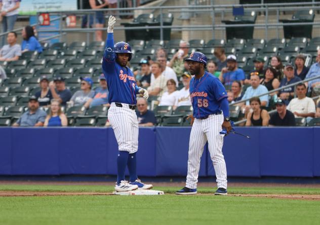 Yonny Hernandez (left) of the Syracuse Mets