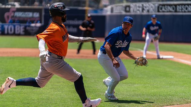 Tulsa Drillers pitcher Chris Campos looks to apply the tag