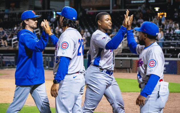 Knoxville Smokies exchange high fives following a win
