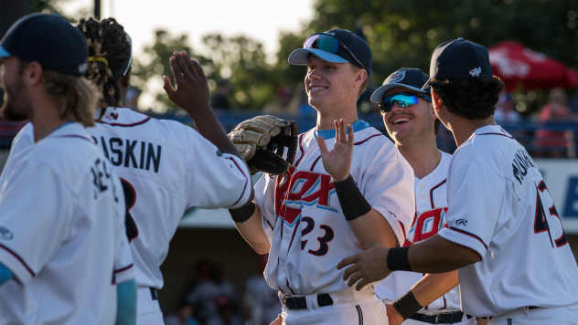 St. Cloud Rox outfielder Brenden Stressler exchanges a high five