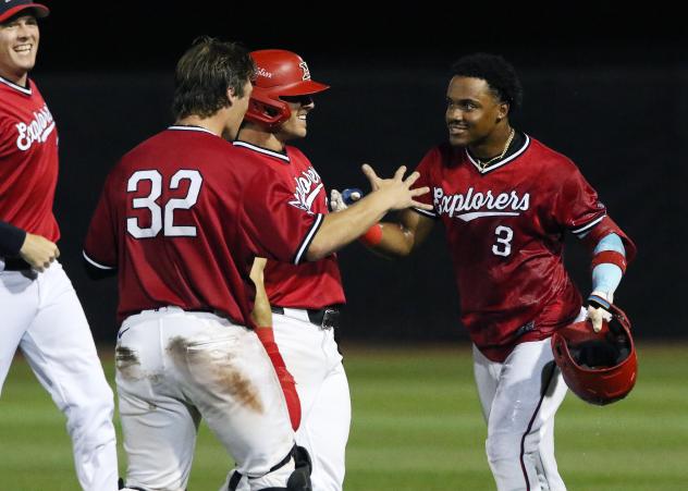 Nick Shumpert #3 of the Sioux City Explorers celebrates with teammates Zac Vooletich and #32 Kurtis Byrne