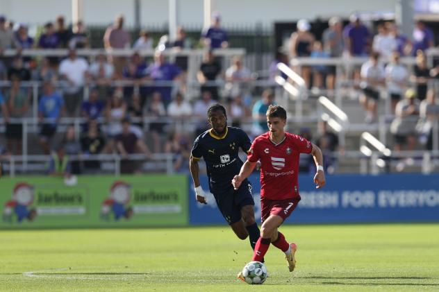 Evan Conway of North Carolina FC advances the ball