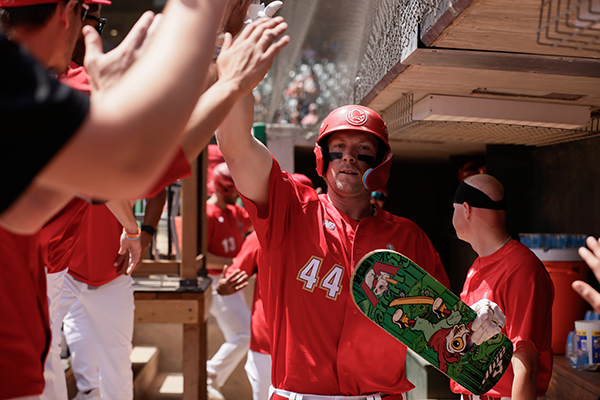 Matthew Warkentin of the Winnipeg Goldeyes receives high fives