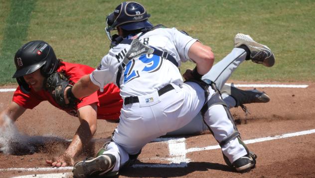 Biloxi Shuckers catcher Darrien Miller applies the tag