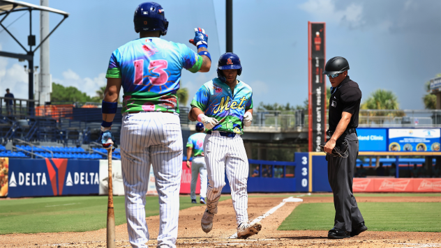 St. Lucie Mets catcher Vincent Perozo greets a teammate at home plate