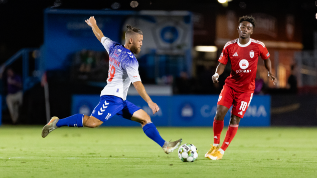 Birmingham Legion FC's Enzo Martinez and Phoenix Rising FC's Hope Avayevu in action