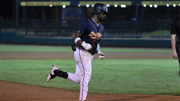 Emmanuel Tapia of the Down East Bird Dawgs rounds the bases