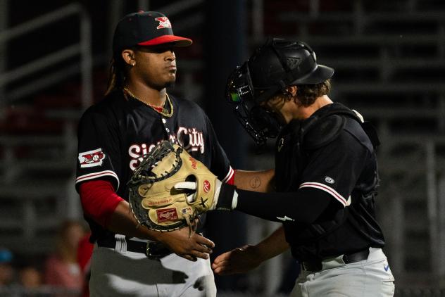 Felix Cepeda and Kurtis Byrne of the Sioux City Explorers celebrate