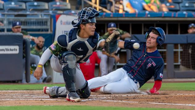 San Antonio Missions' Eli Wilson and Tulsa Drillers' Chris Newell in action