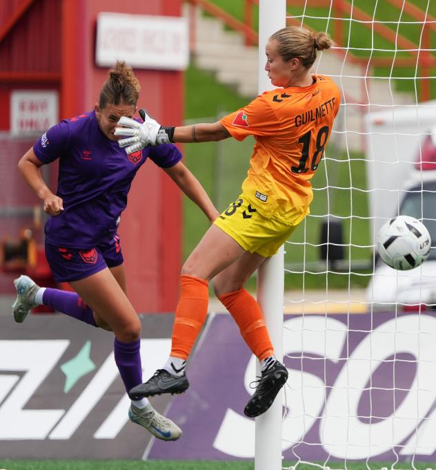 Kathryn Harvey of Calgary Wild FC gets a ball past Halifax Tides FC