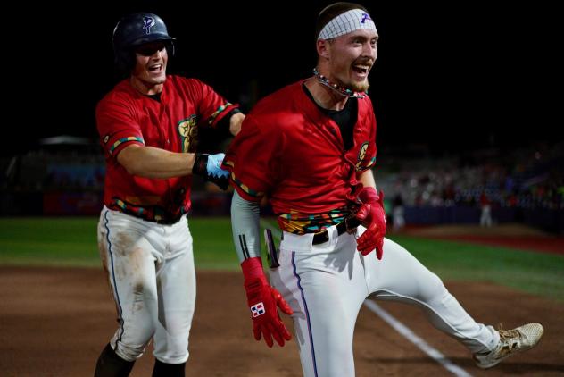 Eric Rataczak and the Pensacola Blue Wahoos celebrate a walk-off win