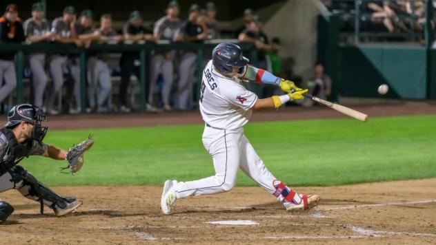 Tri-City Dust Devils catcher Juan Flores at bat