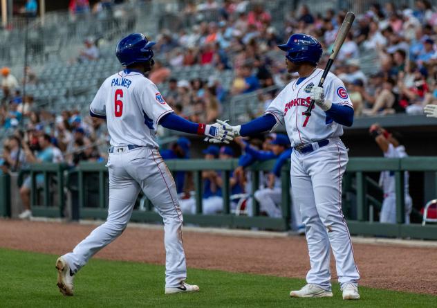 Knoxville Smokies third baseman BJ Murray, Jr. (right) greets shortstop Jaylen Palmer