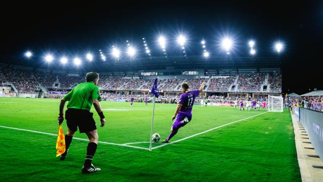 Louisville City FC midfielder Taylor Davila takes a corner kick