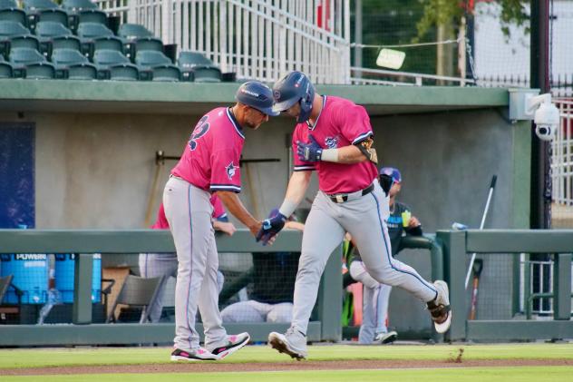 Pensacola Blue Wahoos round the bases