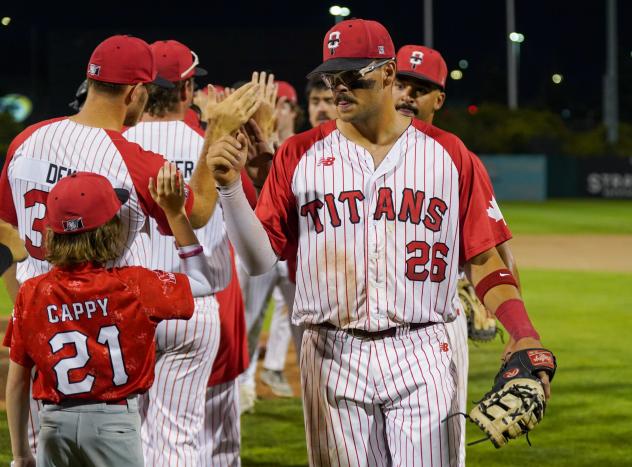 Ottawa Titans exchange high fives following a win