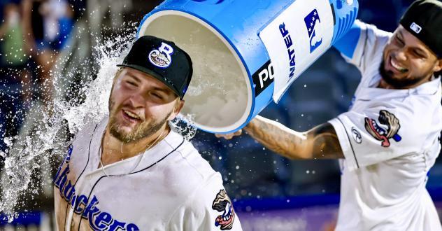 Blake Burke of the Biloxi Shuckers gets a shower