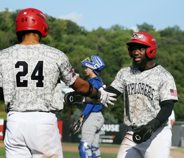 D'Shawn Knowles of the Sioux City Explorers is congratulated by #24 Torin Montgomery