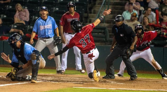 Hickory Crawdads outfielder Hector Osorio slides home