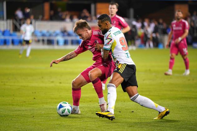 San Jose Earthquakes's Max Floriani battles St. Louis CITY SC's Fallou Fall