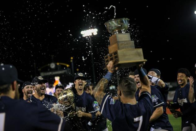 Kane County Cougars celebrate with the Miles Wolff Cup