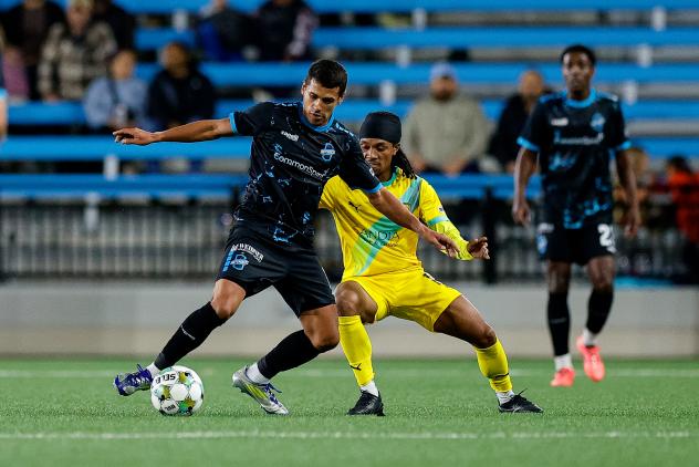 Colorado Springs Switchbacks FC with possession against New Mexico United