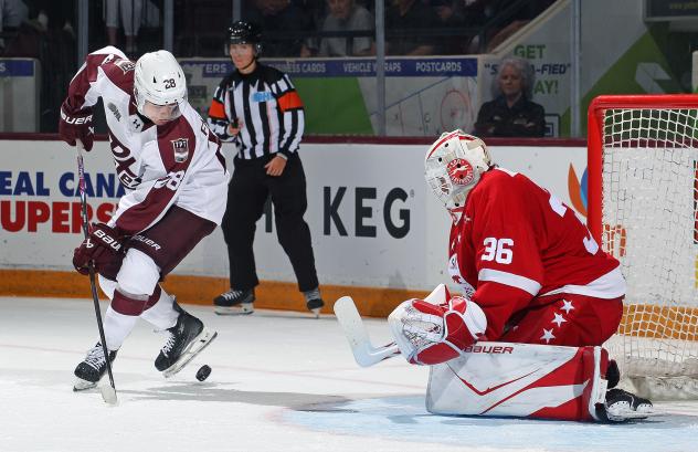 Peterborough Petes left wing Brennan Faulkner (left) vs. the Soo Greyhounds
