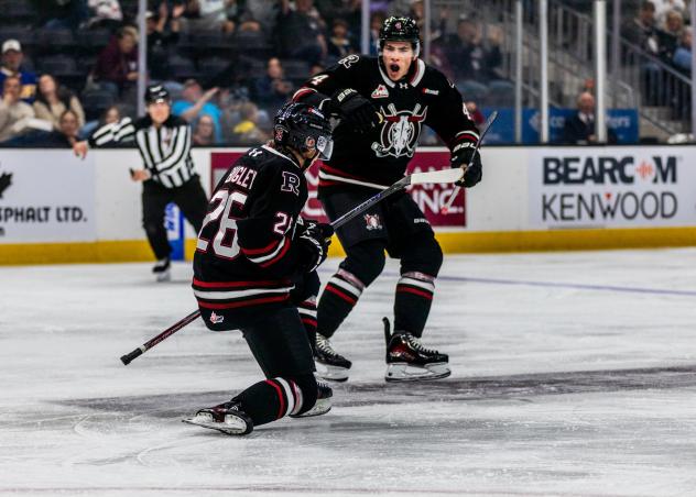 Red Deer Rebels right wing Talon Brigley (left) reacts after a goal