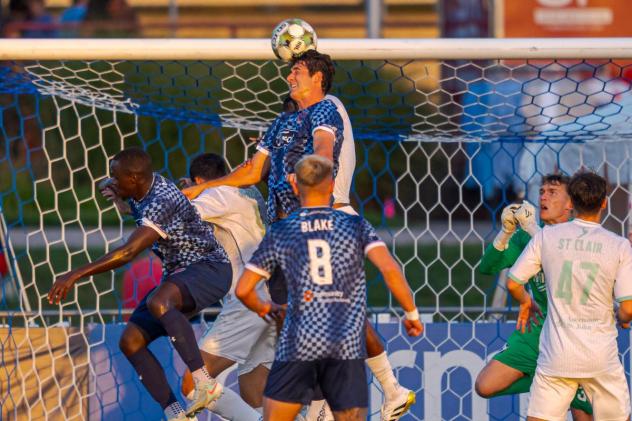 Indy Eleven defender Brian Schaefer heads in a goal