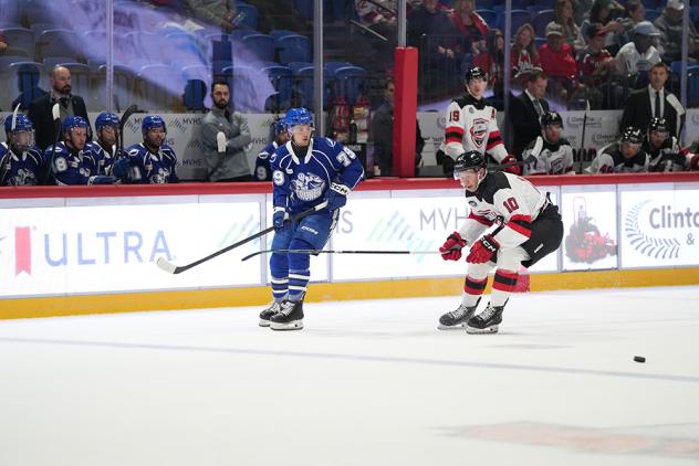 Syracuse Crunch right wing Ethan Gauthier (left) vs. the Utica Comets