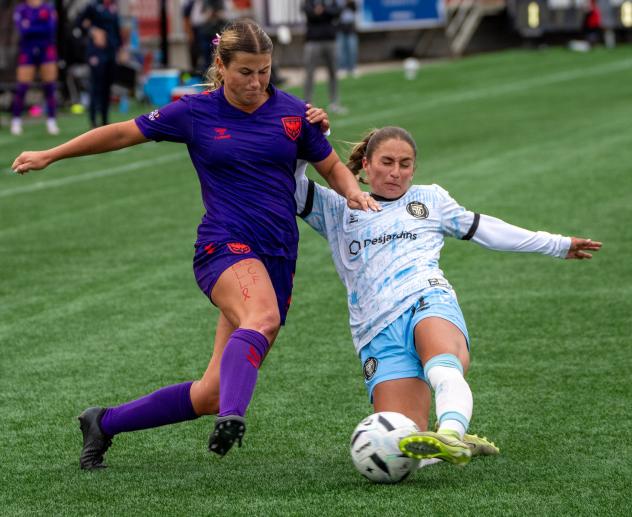 Calgary Wild FC fight for possession with AFC Toronto