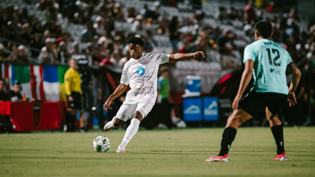Phoenix Rising's Noble Okello and New Mexico United's Talen Maples in action