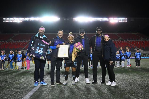 Desiree Scott is honored on the field by Ottawa Rapid FC