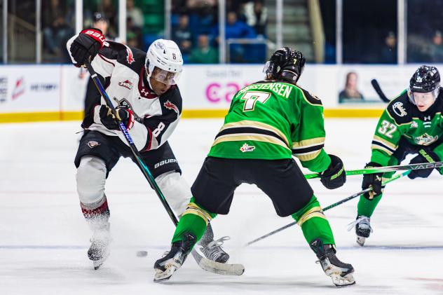 Vancouver Giants left wing Aaron Obobaifo (left) against the Prince Albert Raiders